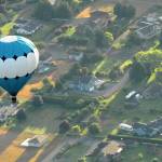 A hot air balloon piloted by Captain Crystal Stout drifts over the Dungeness Valley west of Sequim in this 2012 file photo. (Keith Thorpe/Peninsula Daily News)