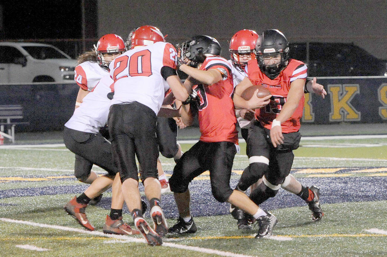 Neah Bay senior Julian Carrick looks for running room during a 2021 game against Mossyrock. Carrick is once again expected to start at quarterback and in the secondary for the Red Devils this season. (Lonnie Archibald/for Peninsula Daily News)