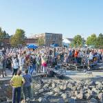 Steve Mullensky/for Peninsula Daily News


Several hundred people assembled at Pope Marine Park on Thursday for the final Concert on the Dock presented by the Port Townsend Main Street Association but also, for a Community Portrait that happened during intermission. Local photographer David Conklin, on the roof of the building, directs the crowd to raise their hands in celebration of the event. The photo session was over in less than 1/500th of a second.