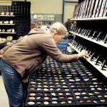 Laurie Nichols of Port Angeles examines a display of gems and pendants at the Rock, Gem & Jewelry Show at Vern Burton Community Center in Port Angeles. The show, hosted by the Clallam County Gem & Mineral Association over the weekend, featured a wide variety of rocks, minerals, crystals and fossils from around the world for sale and for show. (Keith Thorpe/Peninsula Daily News)