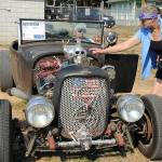 KEITH THORPE/PENINSULA DAILY NEWS
Julie Moen of Port Angeles, right, points the quirks of a "rat rod" built from a 1928 Ford Roadster by Dennis Broderson of Port Angeles, in drivers seat, during Saturday's Kiwanis Car Show at the Clallam County Fairgrounds in Port Angeles. The event a fundraiser hosted by the Kiwanis Club of Port Angeles, featured more than 70 vintage and customized autos and trucks.