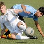 KEITH THORPE/PENINSULA DAILY NEWS
Peninsula's Alfie Tucker, front, gets tangled on the pitch with Pierce's Manuel Lomeli during Saturday's match at Wally Sigmar Field.