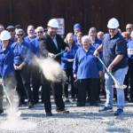 Sequim City Band members break ground on the rehearsal hall expansion project. Pictured with ceremonial shovels are, from left, band president Debbi Soderstrom, band director Tyler Benedict and Neeley Construction superintendent Eli Collier. (Michael Dashiell/Olympic Peninsula News Group)