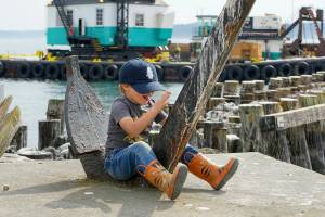 Steve Mullensky/for Peninsula Daily News

Max Albert Ruffo, 4 1/2 from Port Townsend, rides the anchor fluke like a bucking bronco while visiting Point Hudson with his grandma on Tuesday.