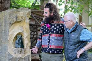 Diane Urbani de la Paz/for Peninsula Daily News
Composer Noah Michael Smith, left, and Camaraderie Cellars winemaker Don Corson admire “Spirit of Hildegard,” Corson’s sculpture in jade. Smith and Corson have collaborated on a performance celebrating Hildegard von Bingen this Saturday.