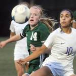 KEITH THORPE/PENINSULA DAILY NEWS
Port Angeles' Anna Petty, left, fights for a loose ball with Sequim's Jennyfer Gomez on Thursday in Port Angeles.