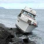 Keith Thorpe/Peninsula Daily News
A pleasure boat sits aground on the north side of Ediz Hook in Port Angeles on Friday.