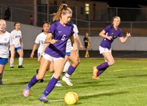 Michael Dashiell/Olympic Peninsula News Group
Sequim High's Teagen Moore, left looks for a teammate as Sequim's Eve Breithaupt looks in early in the second half of the Wolves' 6-1 win over Olympic on Sept. 20.