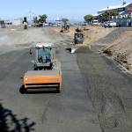 KEITH THORPE/PENINSULA DAILY NEWS
Workers move materials on Wednesday at the site of a future planned four-story, 106-room hotel being built by the Lower Elwha Klallam Tribe between First Street and Railroad Avenue at Laurel Street in downtown Port Angeles. Work resumed on the project this week after delays in the permitting process and reassessment of the hotel plans to account for inflation and other factors. Construction is expected to last from 18 to 24 months.