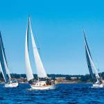 Photo by Fran Reisner Thompson / From left, Denali (skippered by Bob BacCauley), Pinafore (skippered by Bernie Armstrong) and Sirius (skippered by Durkee Richards) compete in the Reach and Row for Hospice on Sequim Bay on Sunday.