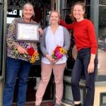From left to right, Boat School Executive Director Betsy Davis and Ajax Café owner Kristan McCary celebrate the recognition of the Galster House, home of the Ajax Café, with this years Mary P. Johnson Award for historic preservation presented by the Jefferson County Historical Society and its executive director, Shelly Leavens.