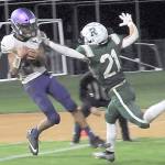 KEITH THORPE/PENINSULA DAILY NEWS
Sequim's Toppy Robideau, left, makes an end-zone reception over the defense of Port Angeles' Tanner Jacobsen in the closing seconds of the fourth quarter to put the Wolves over the Roughriders on Friday night in Port Angeles.