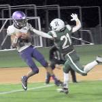 Sequims Toppy Robideau, left, makes an end-zone reception over the defense of Port Angeles Tanner Jacobsen in the closing seconds of the fourth quarter to put the Wolves over the Roughriders on Friday night in Port Angeles. (Keith Thorpe/Peninsula Daily News)