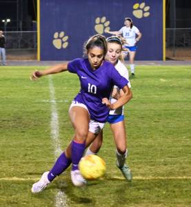 Michael Dashiell/Olympic Peninsula News Group Sequims Jennyfer Gomez vies for the ball with Bremertons Melanie Uhrich in the Wolves 4-0 win in Sequim on Sept. 29.