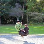 Fiona Krienke, 19, and her brother Hawk, 6, take a spin on the tire swing at Chetzemoka Park in Port Townsend. The 118-year-old city park is named after Chief Chetzemoka, the 19th century SKlallam leader. (Diane Urbani de la Paz/Peninsula Daily News)