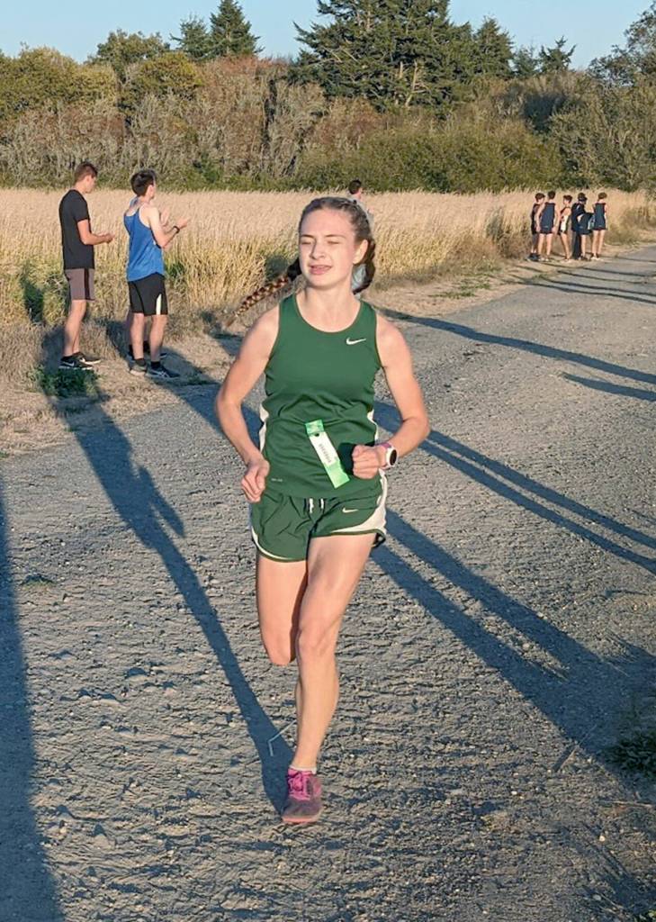Port Angeles Faerin Tait runs during the fifth Olympic League Cross Country meet of the season on Wednesday at the Dungeness Recreation Area near Sequim.