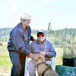 Sandy and Roger Short, along with their dog Blue, took in the sunshine at their Chimacum place Friday morning. Diane Urbani de la Paz/For Peninsula Daily News