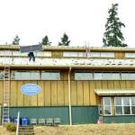 An array of 164 solar panels have been installed on roofs at the upper campus of the Northwest School of Wooden Boatbuilding. (Elizabeth Becker)