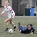 KEITH THORPE/PENINSULA DAILY NEWS
Peninsula's Millie Long, left, watches as Bellevue's Peyton Pine gets tripped up during the first half of Wednesday's match in Port Angeles.