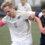 KEITH THORPE/PENINSULA DAILY NEWS
Peninsula's Tim Dreser pushes back against Bellevue's Thomas Nguyen on Wednesday in Port Angeles.