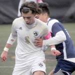 KEITH THORPE/PENINSULA DAILY NEWS
Peninsula's Pau Vivas, front, fends off Bellevue's Bryan De La Rosa during Wednesday's match at Wally Sigmar Field in Port Angeles.