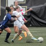 KEITH THORPE/PENINSULA DAILY NEWS
Peninsula's Kenzie Banner, right, slides in front of Bellevue's Ammaya Robinett for ball control on Wednesday at Peninsula's Wally Sigmar Field.
