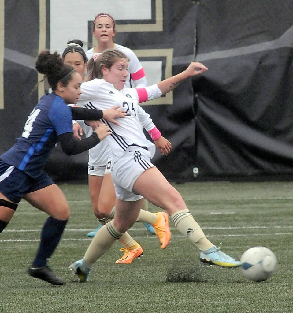KEITH THORPE/PENINSULA DAILY NEWS
Peninsula's Kenzie Banner, right, slides in front of Bellevue's Ammaya Robinett for ball control on Wednesday at Peninsula's Wally Sigmar Field.