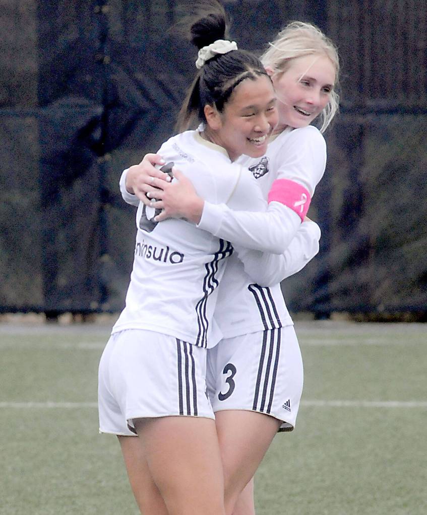 KEITH THORPE/PENINSULA DAILY NEWS
Peninsula's Chiaki Takase, right, celebrates making a goal with teammate Millie Long, who had scored two goals earlier against Bellevue on Wednesday at Peninsula College.