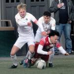 Peninsulas Tim Deser, left, and teammate Alfonso Santos de Cruz battle with Skagit Valleys Oscar Ibarra for a loose ball Saturday in Port Angeles. The Pirates won the physical game 2-1. (Keith Thorpe/Peninsula Daily News)
