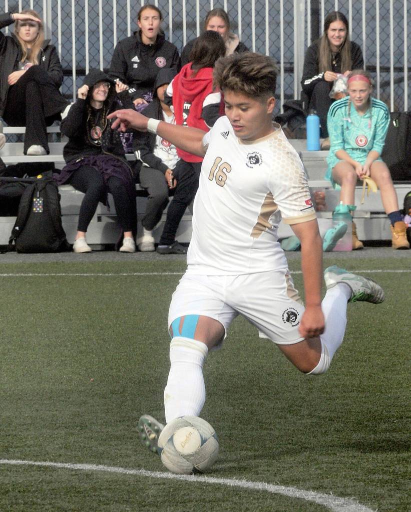KEITH THORPE/PENINSULA DAILY NEWS Peninsulas Yusaku Shimakura takes a penalty kick that resulted in Saturdays initial point against Skagit Valley on Saturday in Port Angeles.