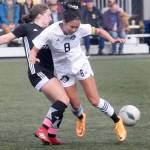 KEITH THORPE/PENINSULA DAILY NEWS Peninsulas Chiaki Takase, left, fends of Skagit Valleys Jordan Cagle on Saturday at Peninsula College in Port Angeles.