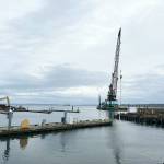 The north end of the Point Hudson Marina is gone, leaving a gaping opening to the marina until it is replaced with a newer breakwater, expected to be in March. The south side will be replaced after the Wooden Boat Festival next September. The M/V Salish is in the background and completing a Monday morning run from Coupeville to Port Townsend. (Steve Mullensky/for Peninsula Daily News)