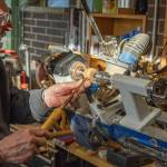 Sequim resident Dave Sellman, five-year member of the Strait Turners, works at a lathe that he set up at an angle so that he could turn wood in his wheelchair. He says that wood turning is accessible for many people who have physical restrictions or space restrictions. His shop is small but contains all the equipment he needs to turn out beautiful pieces that he gives to his loved ones or sells at Shipley Center events, donating all proceeds to charity, especially the VOHCC. He says, I hope that other wheelchair bound individuals will realize that they can be creative and stretch their boundaries. (Emily Matthiessen /Olympic Peninsula News Group)