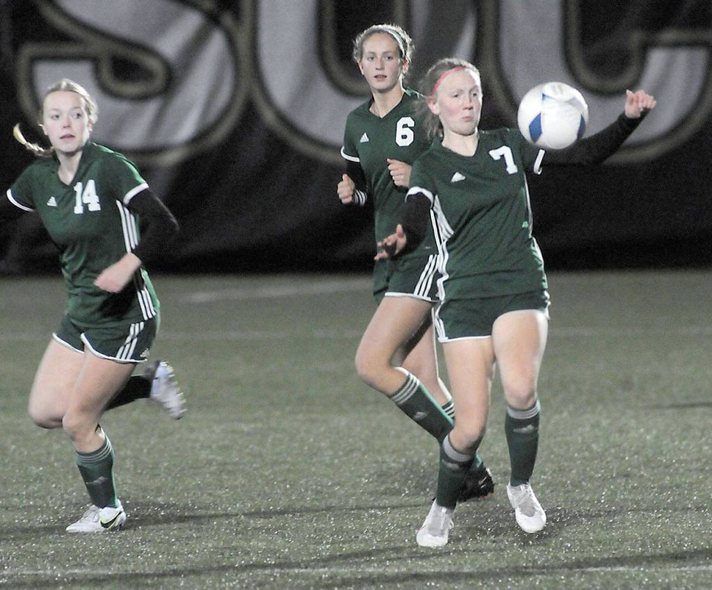 KEITH THORPE/PENINSULA DAILY NEWS Port Angeles Isabelle Felton, right, settles the ball as teammates, Anna Petty, left, and Becca Manson follow behind on Wednesday night in Port Angeles.