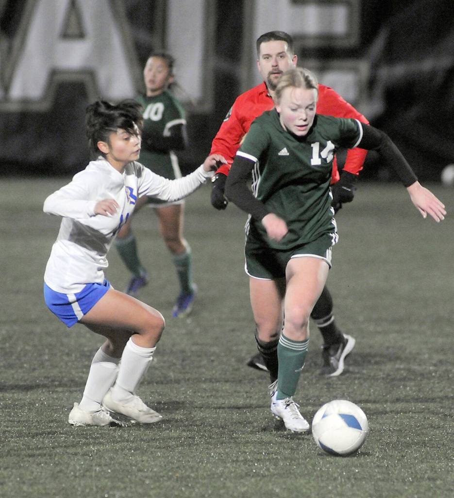KEITH THORPE/PENINSULA DAILY NEWS Port Angeles Anna Petty, right, advances the ball as Bremertons Marisol Popoca-Pablo, left, defends on Wednesday at Wally Sigmar Field in Port Angeles.