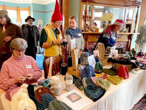 More than 20 vendors selling wool, felted animals, knitted and crocheted items and rugs crowded the first floor of the recently renovated Worthington Mansion during the Quilcene Fiber Festival held Saturday at Worthington Park. (Paula Hunt/Peninsula Daily News)