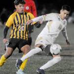 Peninsulas Fernando Tavares keeps the ball away from Walla Wallas Nathan Alvarado during Saturdays NWAC semifinal match at Peninsula College in Port Angeles. (Keith Thorpe/Peninsula Daily News)