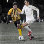 Peninsulas Shu Kato, right, tries to outpace Walla Wallas Nathan Alvarado on Saturday at Wally Sigmar Field. (Keith Thorpe/Peninsula Daily News)