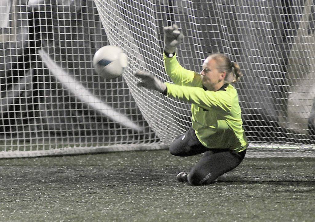 Peninsula goalkeeper Frida Markstrom fends off shot during a penalty shootout to determine a winner of Saturdays NWAC semifinal game against Spokane at Peninsula College in Port Angeles. (Keith Thorpe/Peninsula Daily News)
