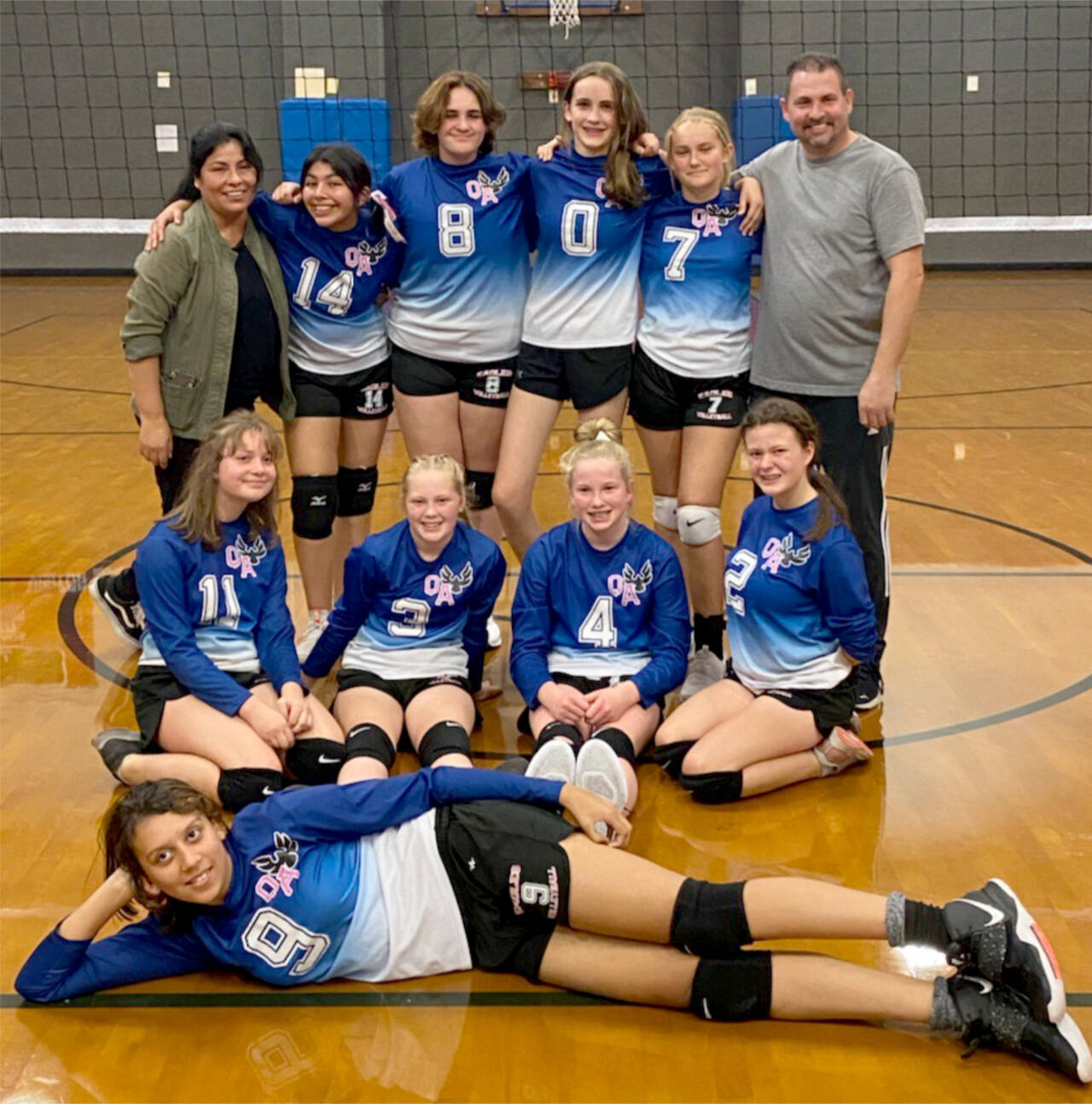 The Queen of Angels volleyball team went 7-3 in its inaugural season. From left, rear, are coach Margarita Lee, Kassi Montero-Lee, Helen Fishman, Ella Desser, Keira Headrick and coach Bill Lee. From left, middle, are Jocelyn Kimball, Peyton Smith, Mariah Traband and Ryah DeLeon. In front is Jessica Rodriguez. (Courtesy photo)