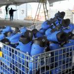 A bin of brand new ice skates awaits unloading as assembly continues on the skating rink on Friday at the Port Angeles Ice Village. (Keith Thorpe/Peninsula Daily News)