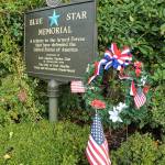 A wreath stands next to the Blue Star Memorial armed forces tribute marker on Thursday at Veterans Park in Port Angeles. (KEITH THORPE/PENINSULA DAILY NEWS)