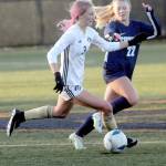 KEITH THORPE/PENINSULA DAILY NEWS Peninsulas Millie Long, left, races downfield with Spokanes Aubrey Thomas in pursuit during Saturdays NWAC quarterfinal game at Wally Sigmar Field in Port Angeles.
