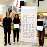 Port Angeles High School Honor Society Advisor John Gallagher, left, poses with Port Angeles Education Academic Achievement Award recipients Liberty Lauer and Lily Halberg.