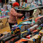 Volunteer Pat Gritman sorts toys at last years Toys for Sequim Kids event. The annual event returns Dec. 14 to the Sequim Prairie Grange with donations accepted throughout the area through Dec. 12. (Matthew Nash /Olympic Peninsula News Group)