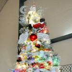 A Christmas tree titled Santas Magic Key stands tall at the 32nd annual Festival of Trees at Vern Burton Community Center in Port Angeles on Friday after it fetched the highest bid during Friday nights gala auction benefiting the Olympic Medical Center Foundation. (Keith Thorpe/Peninsula Daily News)
