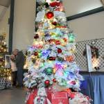 A Christmas tree titled Santas Magic Key stands tall at the 32nd annual Festival of Trees at Vern Burton Community Center in Port Angeles on Friday after it fetched the highest bid during Friday nights gala auction benefiting the Olympic Medical Center Foundation. (Keith Thorpe/Peninsula Daily News)