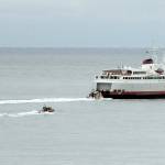 KEITH THORPE/PENINSULA DAILY NEWS
U.S. Coast Guard and law enforcement chase boats follow the ferry MV Coho during an armed passenger drill on Tuesday near the mouth of Port Angeles Harbor.