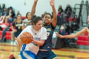 Steve Mullensky/for Peninsula Daily News
East Jefferson's Alyssa Vandenberg drives to the rim while defended by Annie Wright’s Leah Kearns during a December 2021 game played at Port Townsend High School. Vandenberg, a second-team All-Nisqually League selection last season, returns for the Rivals.