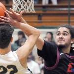 KEITH THORPE/PENINSULA DAILY NEWS
East Jefferson's Lorenzo McCleese, right denies a shot by Port Angeles' Tyler Hunter during Thursday's game in Port Angeles.